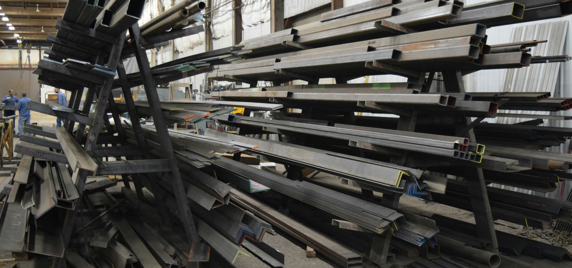 Steel sections racked in a fabrication works