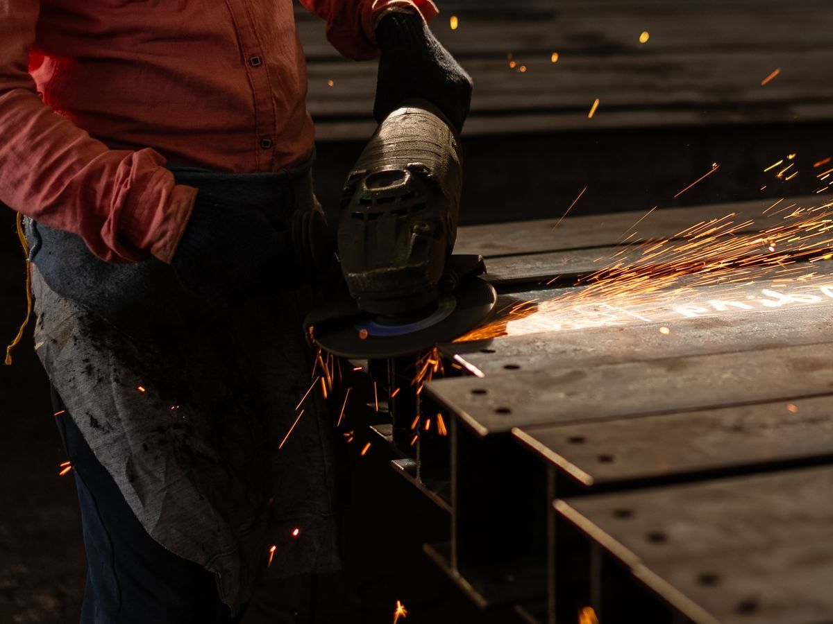 Grinding a fabricated steel section