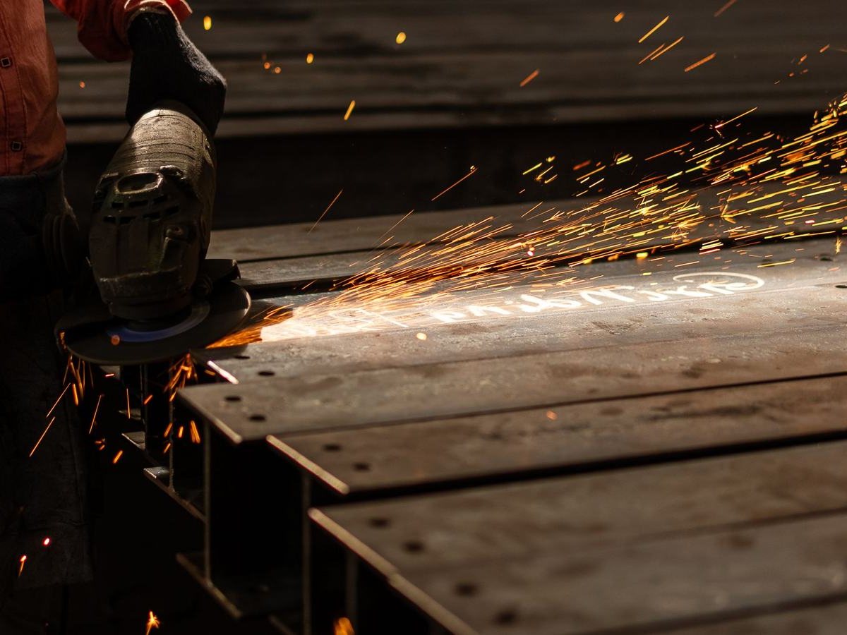 Grinding a welded steel section